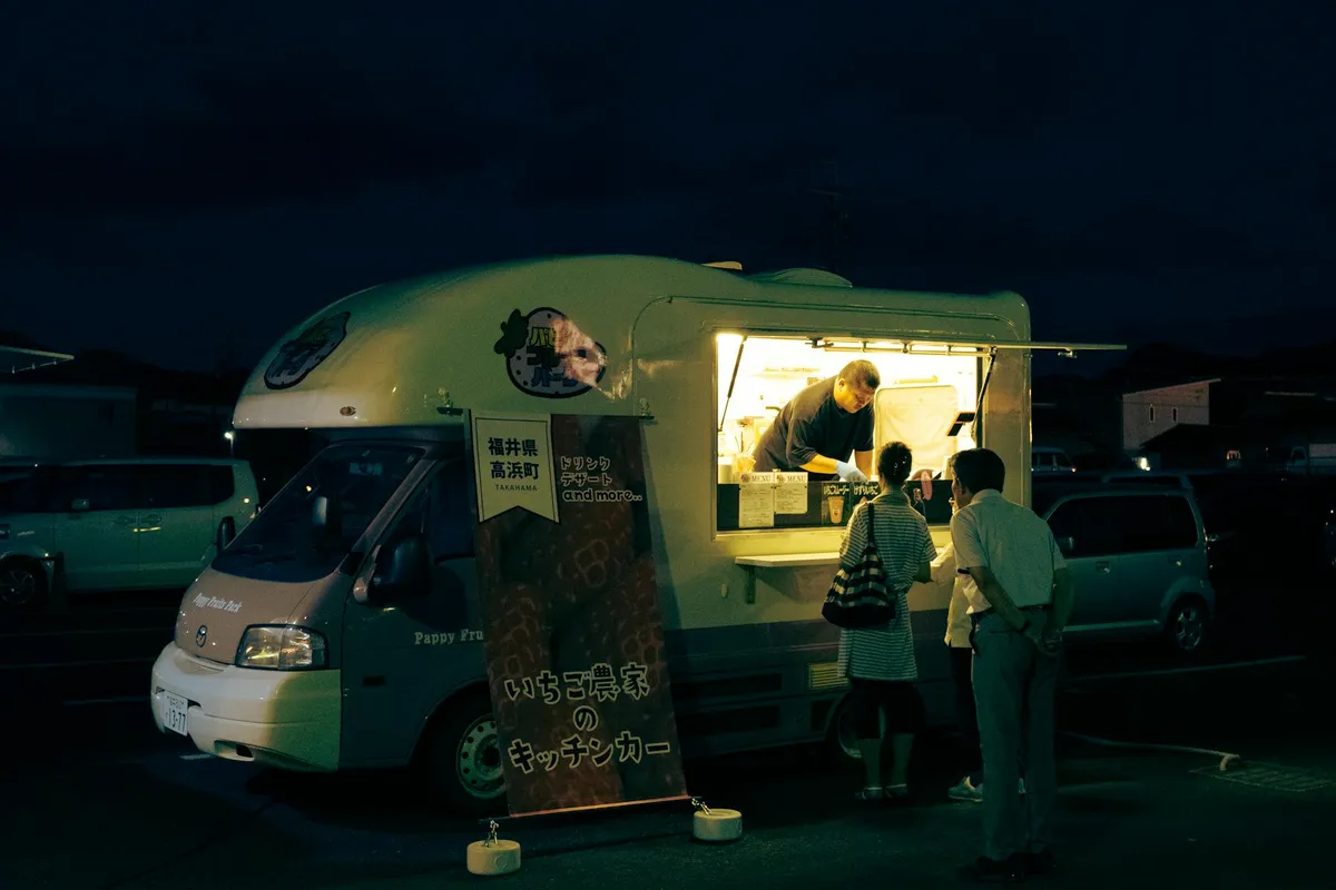Food truck — A bustling food truck in Kyoto serves customers during a vib